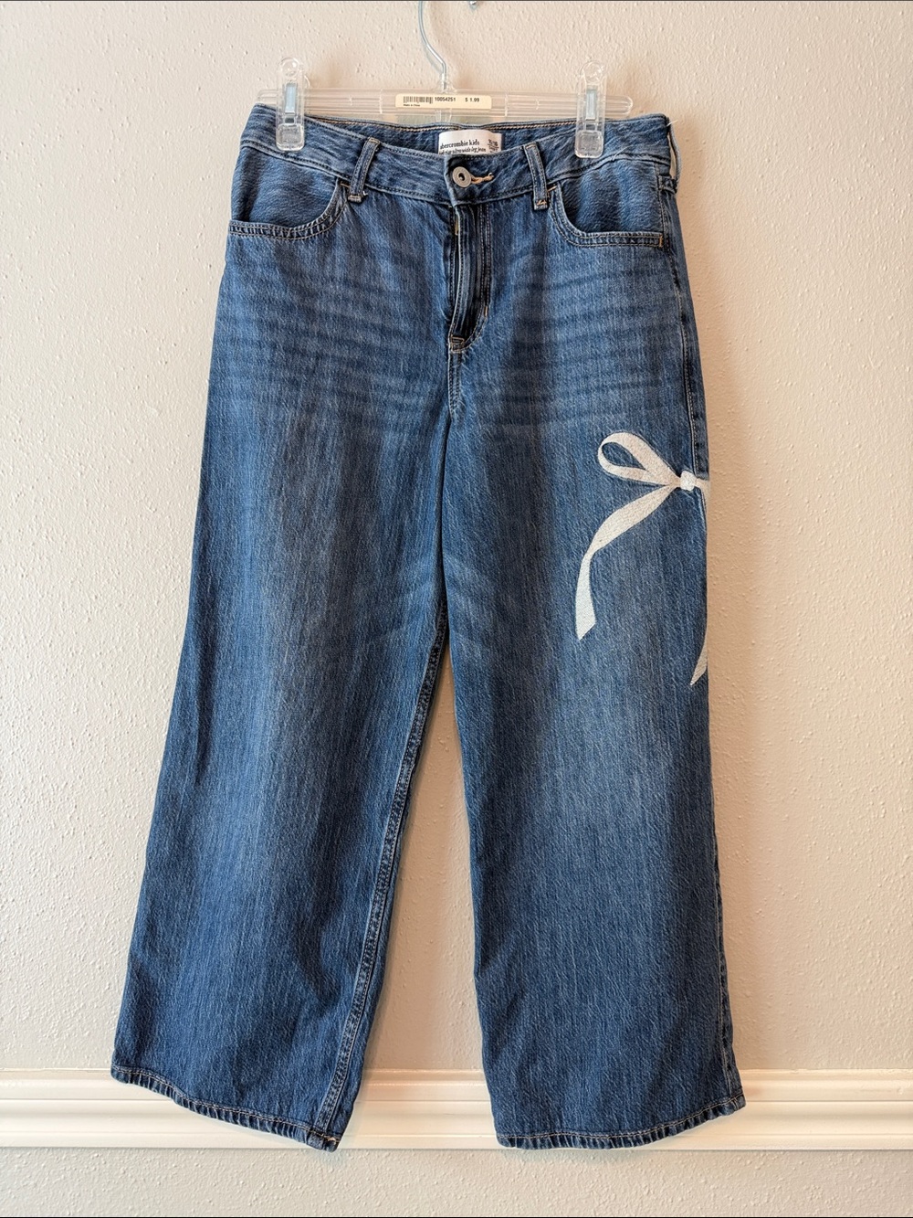 abercrombie kids blue denim wide-leg jeans with white bow